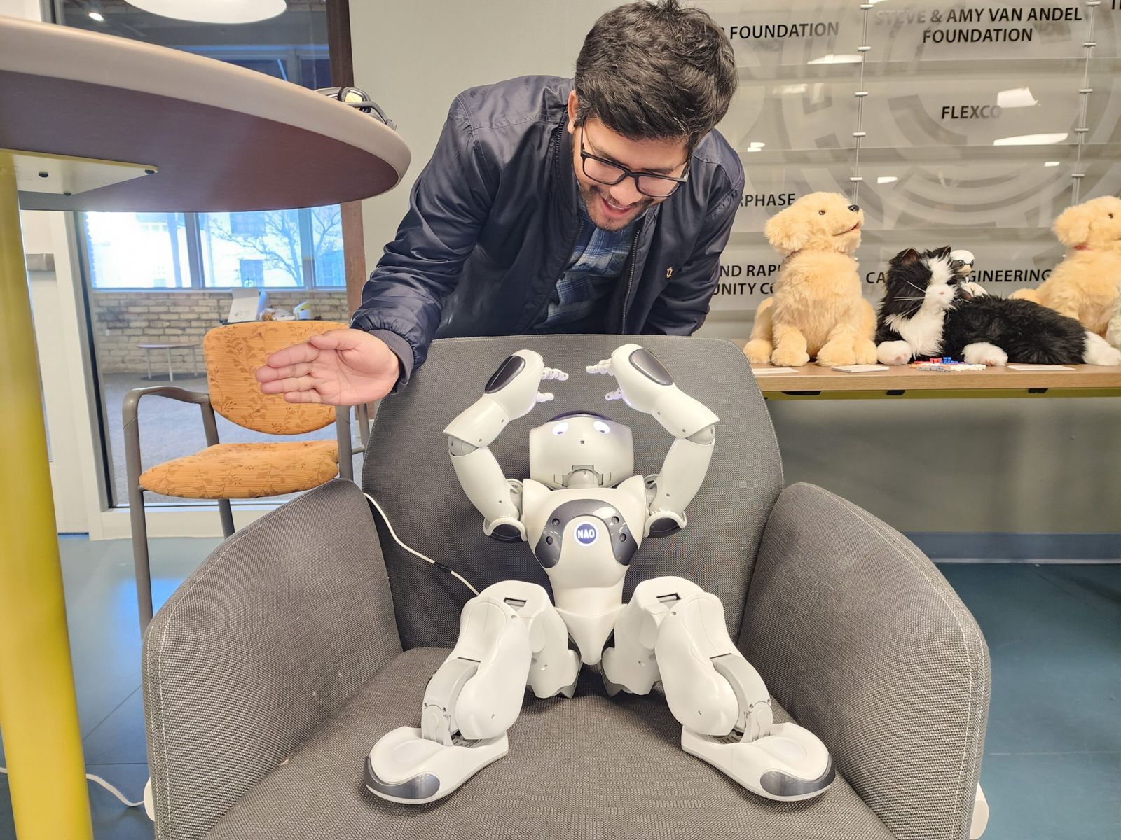 A researcher working with the NAO robot