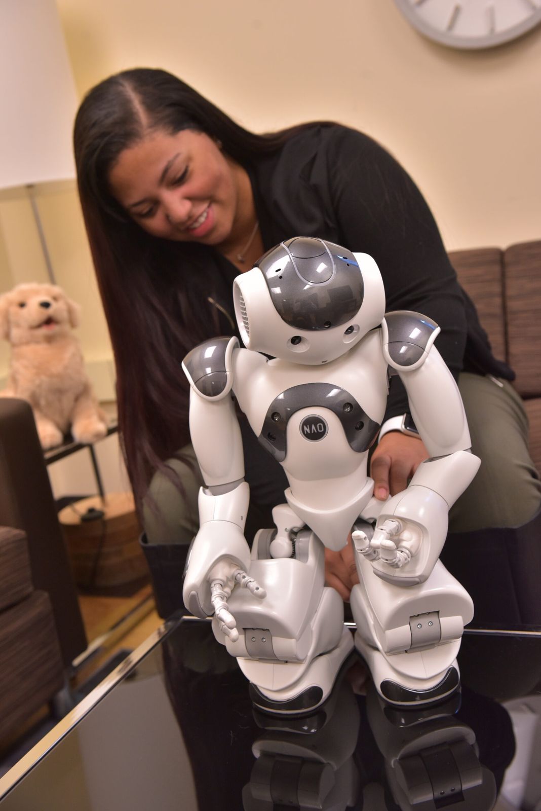 A student holding the NAO robot
